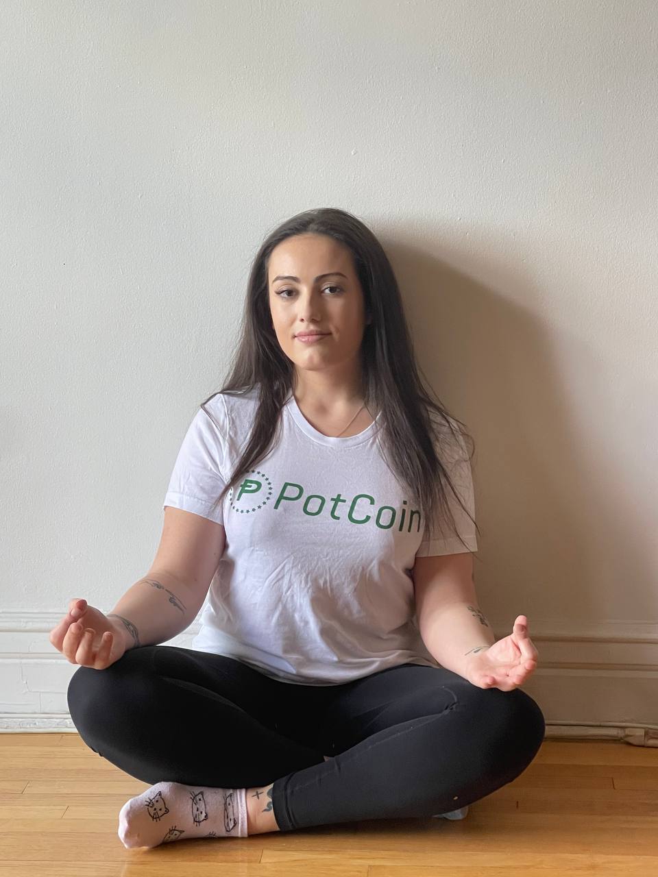 PotCoin Girl: Audrey doing yoga sporting PotCoin swag